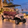 Six-Seater Electric Hotel Shuttle in Dubai Pink six-seat LSV electric golf cart transporting guests at a luxury Dubai hotel