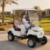 sun-cart-electric-golf-cart-dubai The mxv golf vehicle is driving in the Dubai Resort area.