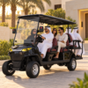 MXV 4+2 Black Golf Cart for Dubai Villas Six adults riding a black SUN-CART MXV 4+2 electric golf cart at a Dubai villa
