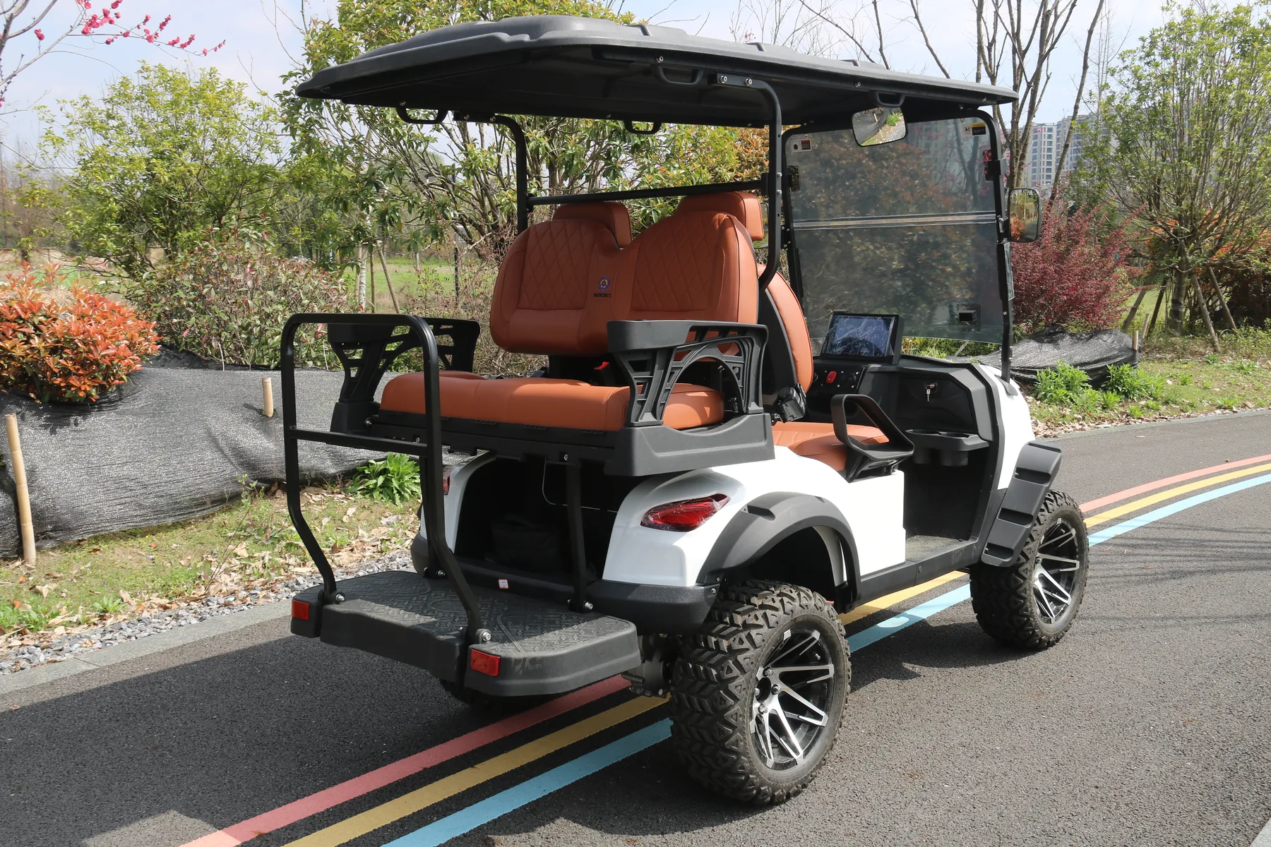 SUN CART MXV 2+2 four-seat electric golf cart on a private-property route